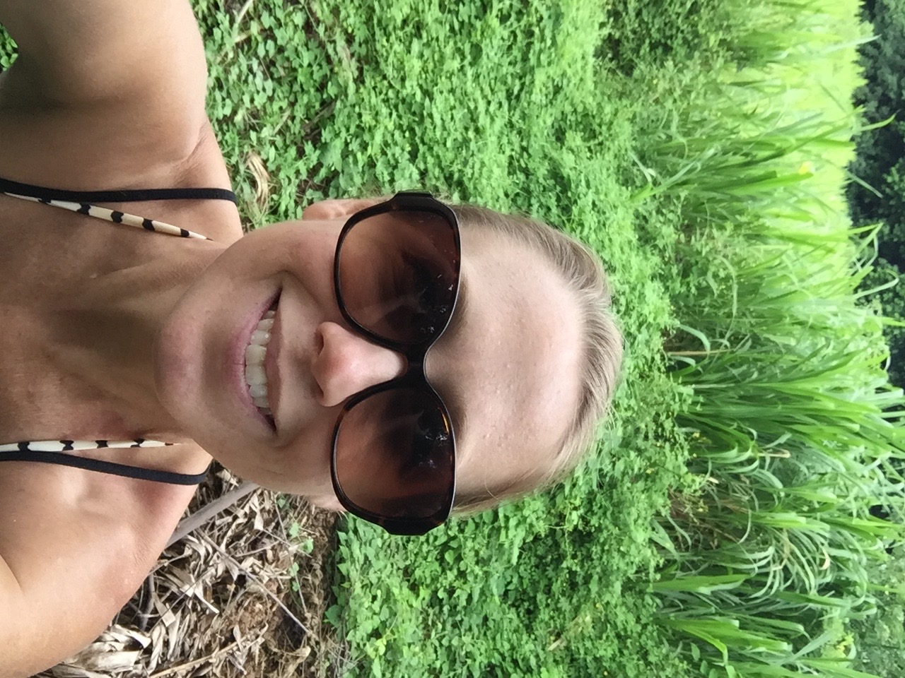 Jungle selfie on Ometepe Island Nicaragua — smiling in front of lush tropical sugarcane and rainforest