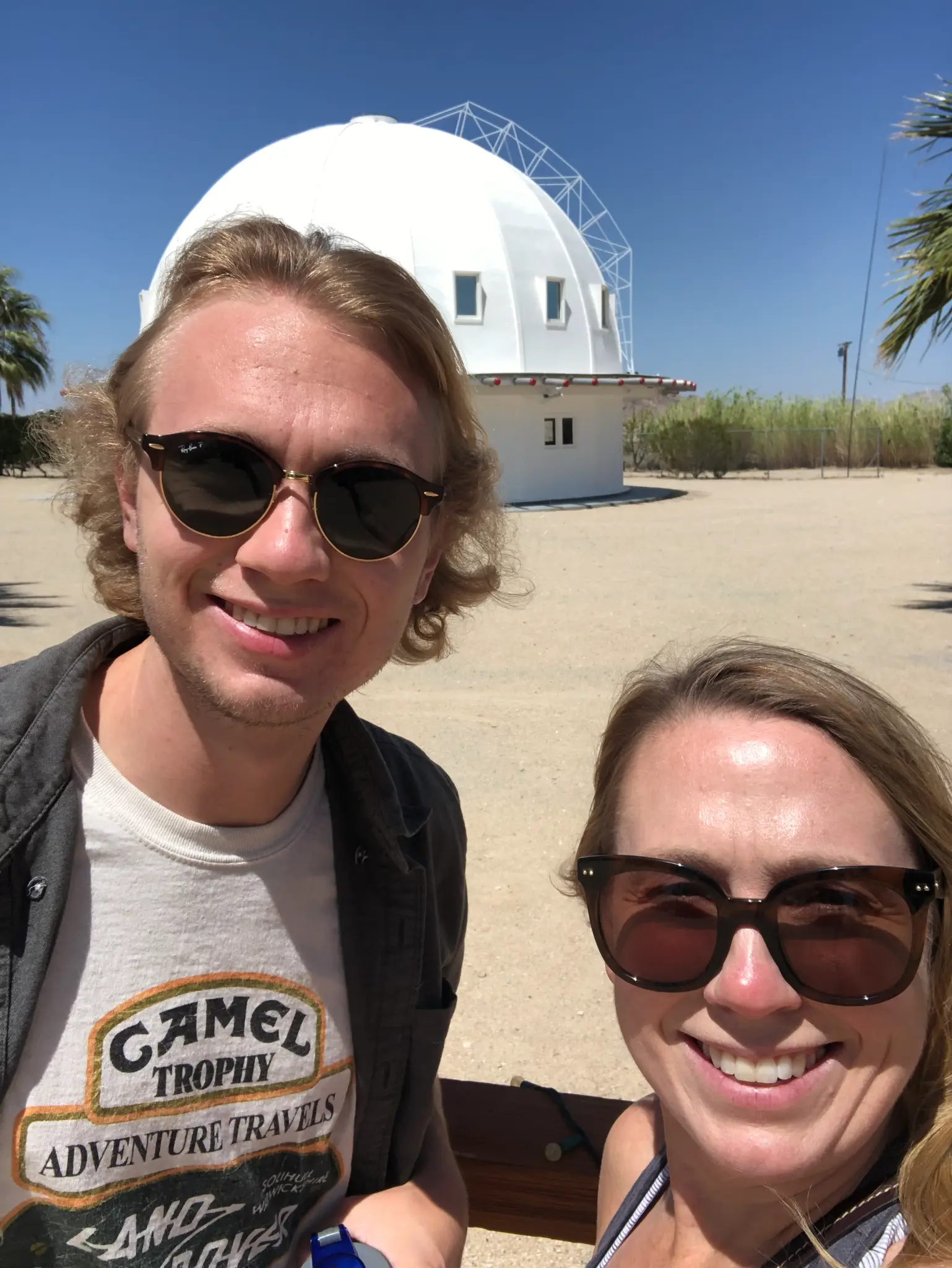 Selfie in front of the Integratron dome in Landers, CA — the white geodesic structure rising from the Mojave desert floor